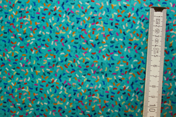 Designerbaumwollstoff Carnival on turquoise (10 cm)
